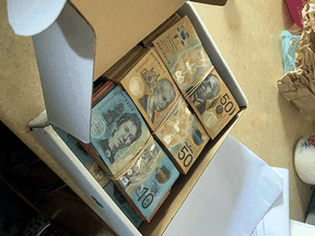 Stacks of cash were seized by Australian police in raids on suspects after the mixer was delivered from Canada.