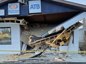 A bank in Warburg, Alta., about 100 km south-west of Edmonton, was severely damaged in a robbery where three suspects used a front-end loader to smash into the building. (Direct-Line Insurance/Supplied).