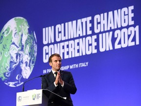 French president Emmanuel Macron speaks during a plenary session as part of the World Leaders' Summit of the COP26 UN Climate Change Conference in Glasgow on November 1, 2021. - COP26, running from October 31 to November 12 in Glasgow will be the biggest climate conference since the 2015 Paris summit and is seen as crucial in setting worldwide emission targets to slow global warming, as well as firming up other key commitments (Photo by ALAIN JOCARD / AFP)