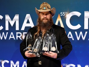 Chris Stapleton poses with his awards for Male Vocalist of the Year, Album of the Year, Single of the Year and Song of the Year 55th Annual Country Music Association (CMA) Awards last month.