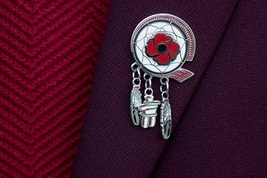 An Indigenous veterans pin is visible on veteran Walter (Wally) Sinclair's jacket, as he takes part in the Indigenous Veterans Day ceremony at the Alberta Legislature in Edmonton, Monday Nov. 8, 2021.