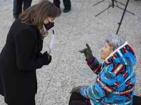 Lieutenant Governor of Alberta Salma Lakhani chats with Elder Elsie Paul during the Indigenous Veterans Day ceremony at the Alberta Legislature in Edmonton, Monday Nov. 8, 2021. Lakhani cancelled her traditional New Year's Day greeting at Government House over concerns about COVID-19 and the cold weather.
