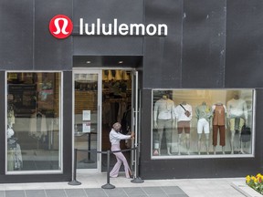 A Lululemon employee at the company's store in Toronto's Yorkville area on May 3, 2021.