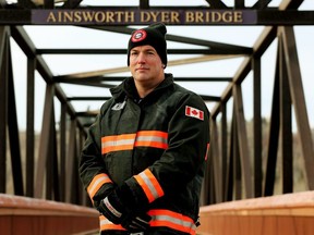 Firefighter Jeff Readman poses for a photo on the Ainsworth Dyer Memorial Bridge, in Edmonton, Wednesday, Nov. 3, 2021.