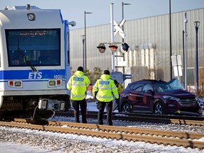 One person was taken to hospital after an Edmonton Transit Services LRT train collided with a motor vehicle near 66 Street and 125 Avenue in Edmonton on Wednesday morning, November 24, 2021.