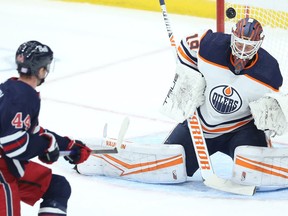 A backhand shot from Winnipeg Jets defenceman Josh Morrissey goes over Edmonton Oilers goaltender Mikko Koskinen in Winnipeg on Tues., Nov. 16, 2021.  KEVIN KING/Winnipeg Sun/Postmedia Network