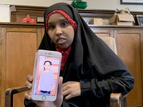 Nasro Mohamed holds up an image of her young daughter, Afnaan.