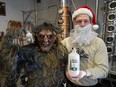 Adam Smith (right), owner of Strathcona Spirits in Edmonton, and his furry friend "Krampus" with his distillery's new Velvet Cream liqueur.
