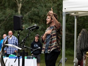 Alliance White, Robert White's younger son, gives a eulogy in memory of his father during a celebration of life held for the artist, family man and friend at Buena Vista Park in Edmonton, on Sunday, Aug. 8, 2021.