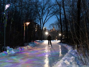 A skater takes in the lights on the IceWay at Victoria Park  in Edmonton, on Monday, Dec. 6, 2021. Photo by Ian Kucerak