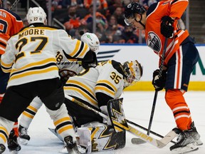 Edmonton Oilers’ Jesse Puljujarvi (13) is stopped by Boston Bruins’ goaltender Linus Ullmark (35) during first period NHL action at Rogers Place in Edmonton, on Thursday, Dec. 9, 2021.