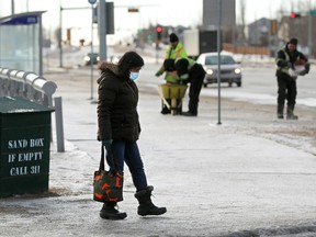 A cautious pedestrian makes their way along an ice covered sidewalk near 17 Street and Tamarack Way NW, in Edmonton Thursday Dec. 9, 2021. Photo by David Bloom