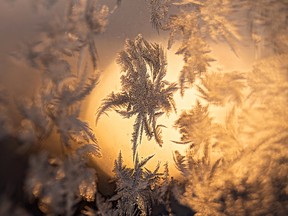 Ice forms on a window pane during a cold snap in Edmonton, on Wednesday, Dec. 15, 2021. Photo by Ian Kucerak
