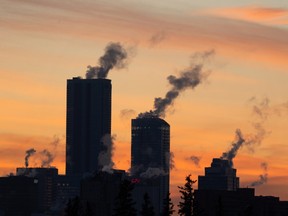 Steam rises from downtown buildings during a cold snap, as seen from Ada Boulevard and 75 Street in Edmonton, on Wednesday, Dec. 15, 2021. Photo by Ian Kucerak