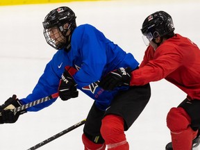 Shane Wright (left) and Elliot Desnoyers drill during a Team Canada practice ahead of the 2022 IIHF World Junior Championship at the Downtown Community Arena at Rogers Place in Edmonton, on Wednesday, Dec. 22, 2021.