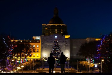 Visitors take in holiday lights during the annual Legislature Light-Up hosted by Premier Jason Kenney in Edmonton, on Thursday, Dec. 2, 2021. The event kicks off Celebrate the Season at the Alberta Legislature.