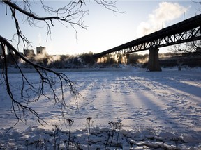 Mist rises from the North Saskatchewan River near the High Level Bridge on Monday, Dec. 27, 2021 in Edmonton.   Temperatures are expected to dip to -35C overnight.