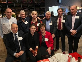 Members of Edmonton’s Polish community, including Thomas Lukaszuk, back row second from right, gather at Rigoletto’s downtown restaurant on Friday, Dec. 10, 2021, to thank Canadians for helping them overthrow a communist regime.