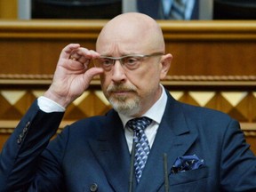 Ukraine's Deputy Prime Minister Oleksii Reznikov adjusts glasses during a session of parliament in Kyiv, Ukraine November 4, 2021.