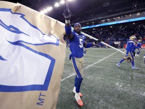 Winnipeg Blue Bombers DE Willie Jefferson celebrates on the field after beating the Saskatchewan Roughriders in the CFL West Final in Winnipeg on Sun., Dec. 5, 2021.