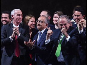 Carlos Cordeiro (2nd L), U.S. Football Association president, Mexican Football Association president Decio de Maria Serrano (2nd R) and Steve Reed (L), president of Canadian Soccer Association, react following announcement that the United bid will host the 2026 World Cup.