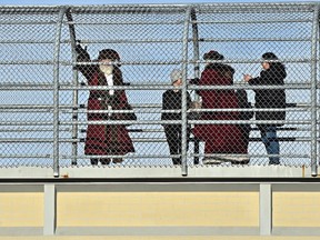 Mr. and Mrs. Claus were greeting people and waving to the honking vehicles on a pedestrian bridge overpass in St. Albert, December 11, 2021. Ed Kaiser/Postmedia