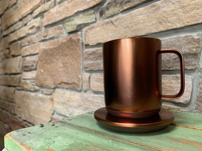 Ember temperature control mug, with charging coaster, in copper.