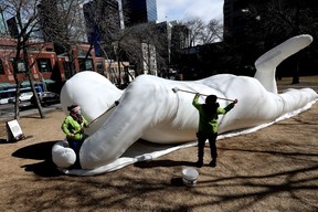 I drove past this sculpture every day waiting for this moment to happen. Karlie Christie and Renee Jobson wash a giant inflatable sculpture in Edmonton’s Abbey Glen Park on April 8, 2021. The sculpture was one of six large-scale art installations titled Fantastic Planet that were installed as part of the Downtown Spark event. Downtown Spark was a program designed to support economic recovery amid the COVID-19 pandemic by drawing visitors to the Downtown core.
