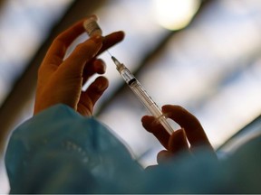 A medical worker prepares a dose of the Pfizer-BioNTech COVID-19 vaccine.