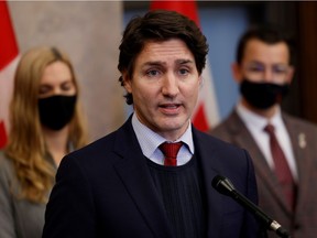 Canada's Prime Minister Justin Trudeau, with Minister of Sport Pascale St-Onge and Parliamentary Secretary to the Minister of Sport Adam van Koeverden, speaks during a press conference on a diplomatic Olympic boycott on Parliament Hill in Ottawa, Ontario, Canada, December 8, 2021.