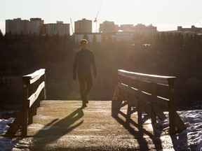 A runner come up the stairs at Ezio Faraone Park from the river-valley on Friday, Dec. 3, 2021  in Edmonton.   Greg Southam-Postmedia