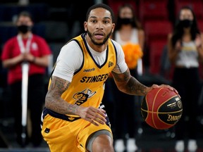 Edmonton Stingers guard Xavier Moon takes control of the ball during Canadian Elite Basketball League game action against the Hamilton Honey Badgers in Edmonton on June 26, 2021.