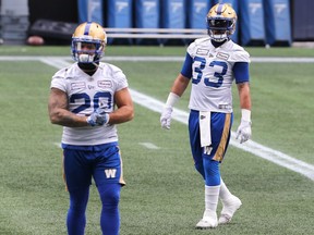Running backs Andrew Harris (right) and Brady Oliveira during Winnipeg Blue Bombers practice on Wednewsday, Dec. 1, 2021.