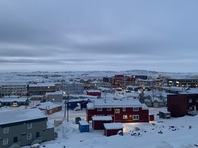Downtown Iqaluit, Nunavut, is shown after 2 p.m. sunset on Tuesday, Nov. 24, 2020. Iqaluit, like the rest of Nunavut, is under a strict two-week lockdown to help stop the spread of COVID-19. THE CANADIAN PRESS/Emma Tranter