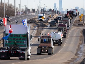 A convoy of trucks, cars and pickup trucks is driving east on Highway 16A from Devon to convoy to the Alberta Legislature in support of the National Freedom Convoy 2022, Saturday, January 29, 2022.