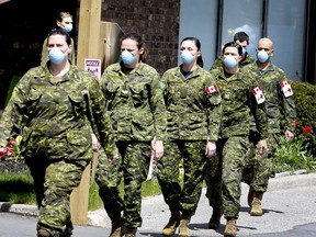 Members of the Canadian Armed Forces in front of Pickering's Orchard Villa long-term care home on Wednesday May 6, 2020.