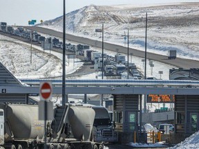 Traffic backs up at the Canada-U.S. border crossing at Coutts, Alberta, on March 20, 2020, during the early days of the pandemic.