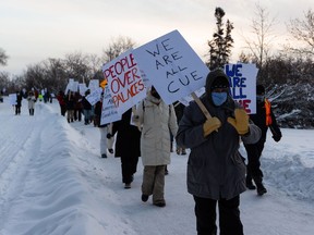 Concordia University Faculty Association members demonstrate in front of the Magrath Mansion during a strike  in Edmonton, on Tuesday, Jan. 4, 2022. Photo by Ian Kucerak