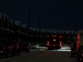 Dark houses are seen in the Glenridding Heights neighbourhood during a power outage that affected 42,000 Edmontonians in multiple neighbourhoods in Edmonton on Monday, Jan. 10, 2022.