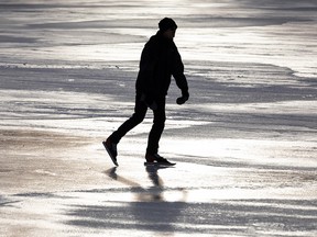 A skater enjoys a warm afternoon of skating on the rink at Hawrelak Park in Edmonton, on Tuesday, Jan. 25, 2022.