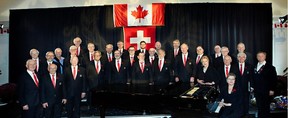 Choir President Hans Voegeli, back row, first from left, with the Swiss Men's Choir and its director Elizabeth Anderson, front row, fourth from right, and assistant director and pianist Irena Tarnawsky, seated in the piano.