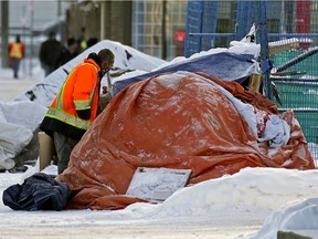 A homeless encampment on 100 Street near 106 Avenue during an extreme cold snap in Edmonton. Advocacy groups are calling on the city to keep access to LRT stations open overnight for vulnerable residents.
