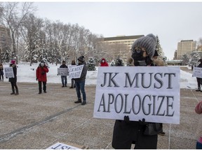 Members of Edmonton's Chinese communities gathered outside the Alberta legislature on Saturday, Jan. 1, 2022, to protest Premier Jason Kenney's remarks about "bat soup" as a source of the COVID-19 pandemic.