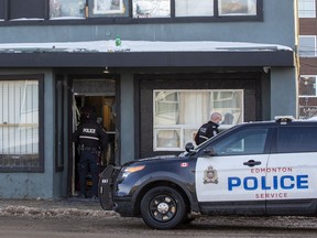 Police execute a search warrant at a building on 111 Avenue near 93 Street in relation to an ongoing investigation on Wednesday, Jan. 12, 2022 in Edmonton.   Greg Southam-Postmedia