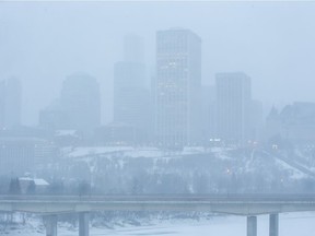 Heavy snow fall partially obscures downtown Edmonton on Monday, Jan. 17, 2022.