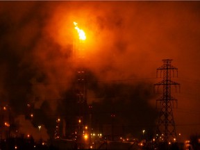 A flare from the Suncor Energy Edmonton Refinery illuminates the sky in Strathcona County, on Friday, Jan. 21, 2022.