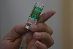 A medical staff fills a syringe with the Covishield, AstraZeneca-Oxford’s Covid-19 coronavirus vaccine in Mumbai on April 19, 2021.