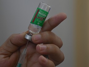 A medical staff fills a syringe with the Covishield, AstraZeneca-Oxford's Covid-19 coronavirus vaccine in Mumbai on April 19, 2021.