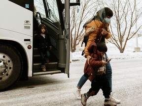 Some of 170 Afghan refugees arrived in Edmonton on Friday, Jan. 14, 2022, and were welcomed by Catholic Social Services, who will assist them in resettling. The group includes human rights defenders and their families who were able to flee to Pakistan and were put on a Canada-arranged charter flight on Jan. 11, 2022.