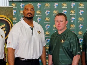 Stephen McAdoo (left) and Chris Jones appear in a photo of the Edmonton Elks coaching staff in 2014.